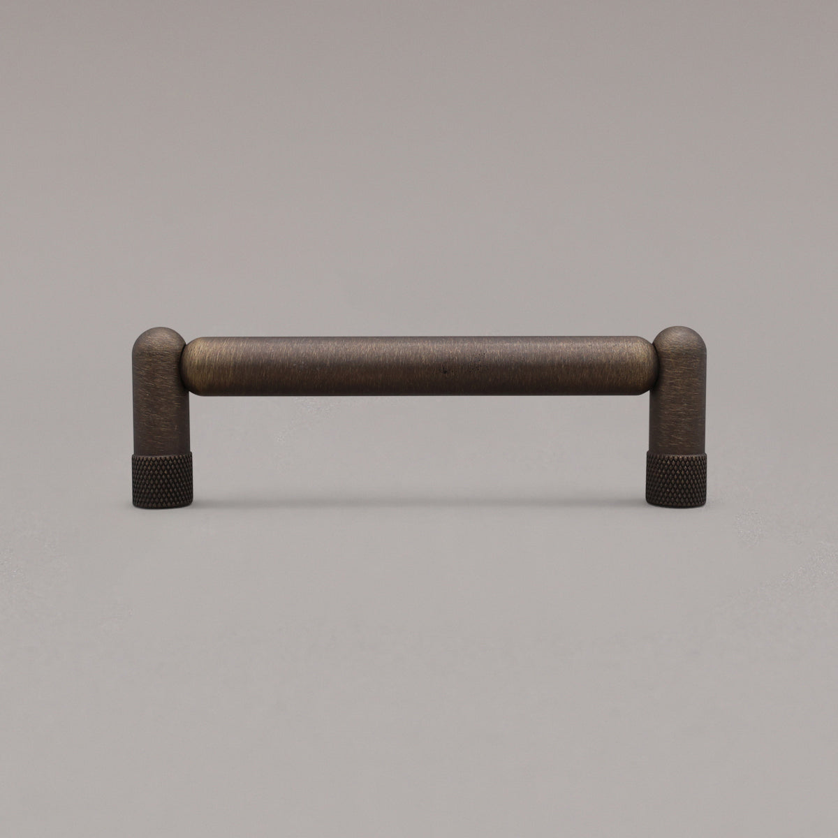 standing knurled antique english cabinet pull on gray background