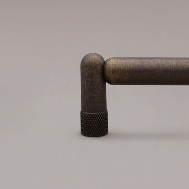 Close up of Knurled antique english stem on gray background