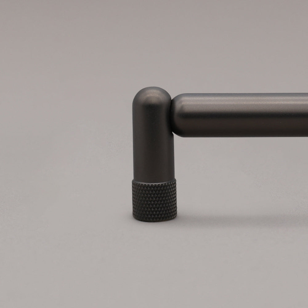 close up of knurled graphite stem on gray background