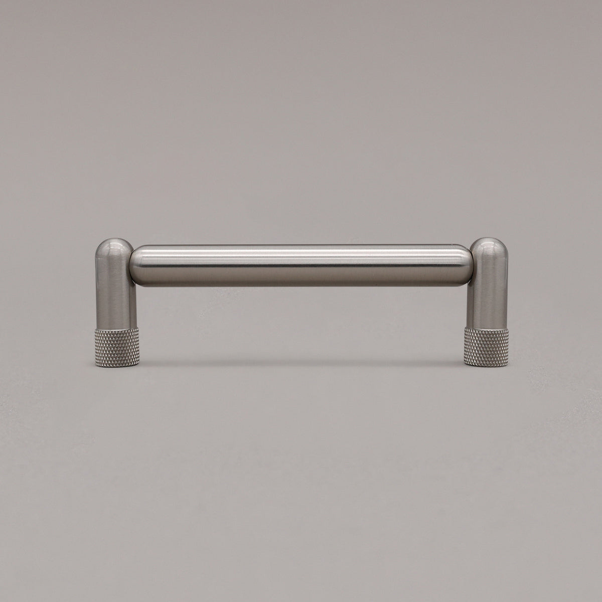 standing knurled satin nickel silver cabinet pull on gray background
