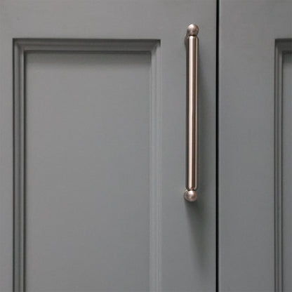 Gray cabinet door with a bronze handle