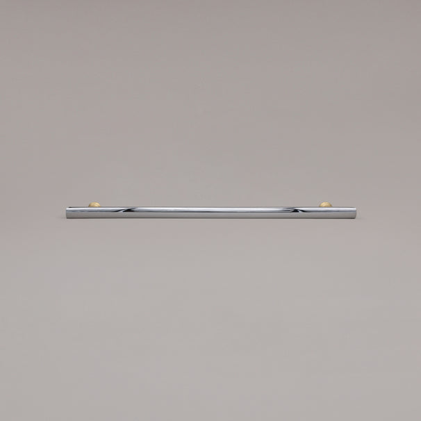 18" Mod appliance pull in Polished Chrome and Satin Brass laying on gray background