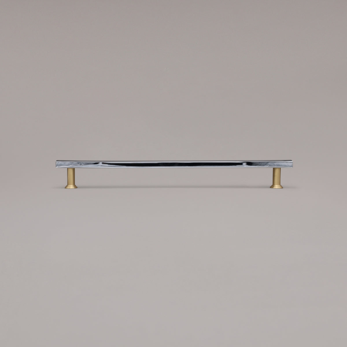 18" Mod appliance pull in Chrome and Satin Brass standing on gray background