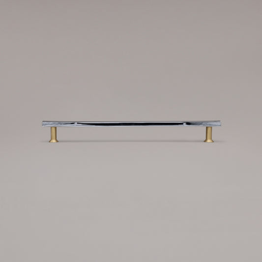 18" Mod appliance pull in Black and Satin Brass standing on gray background