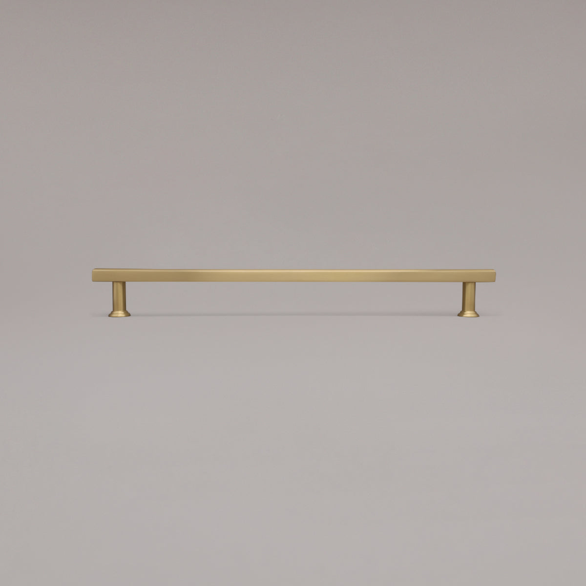 18" Mod appliance pull in Satin Brass standing on gray background