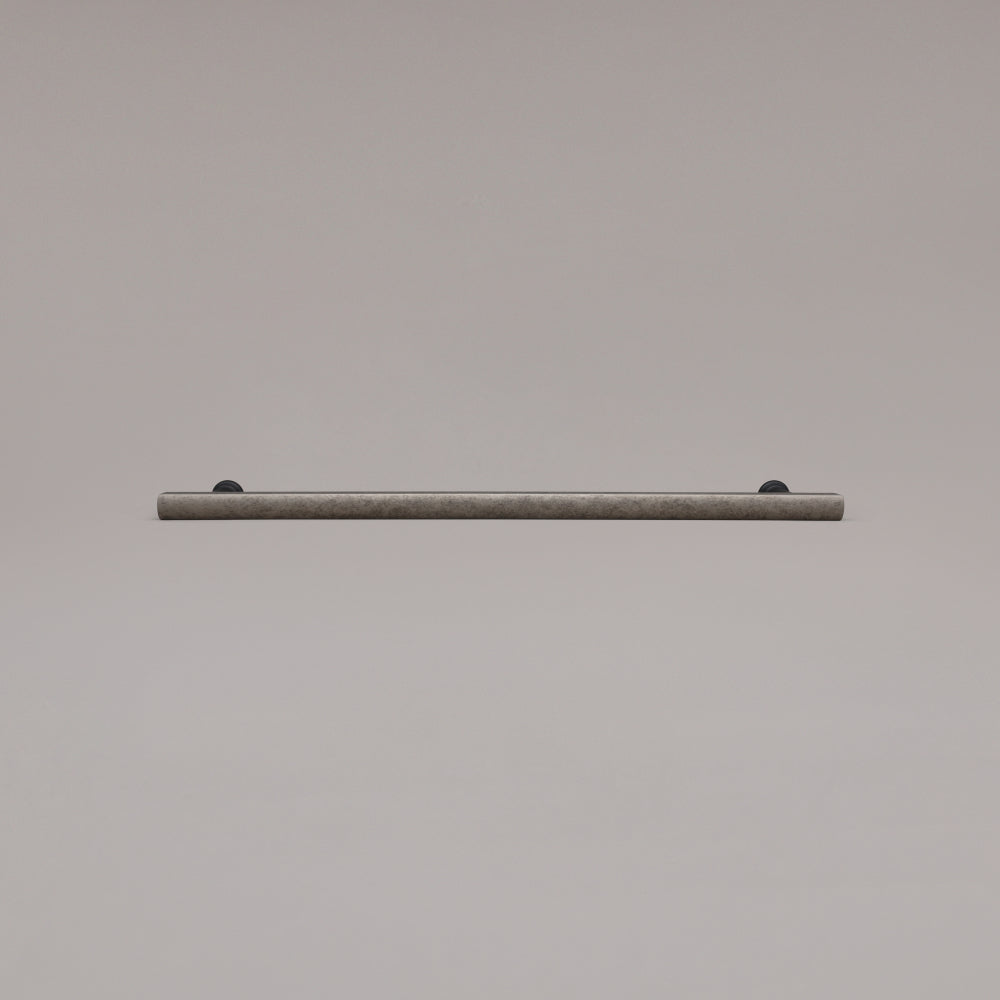 18" Mod appliance pull in Weathered Nickel and Matte Black laying on gray background