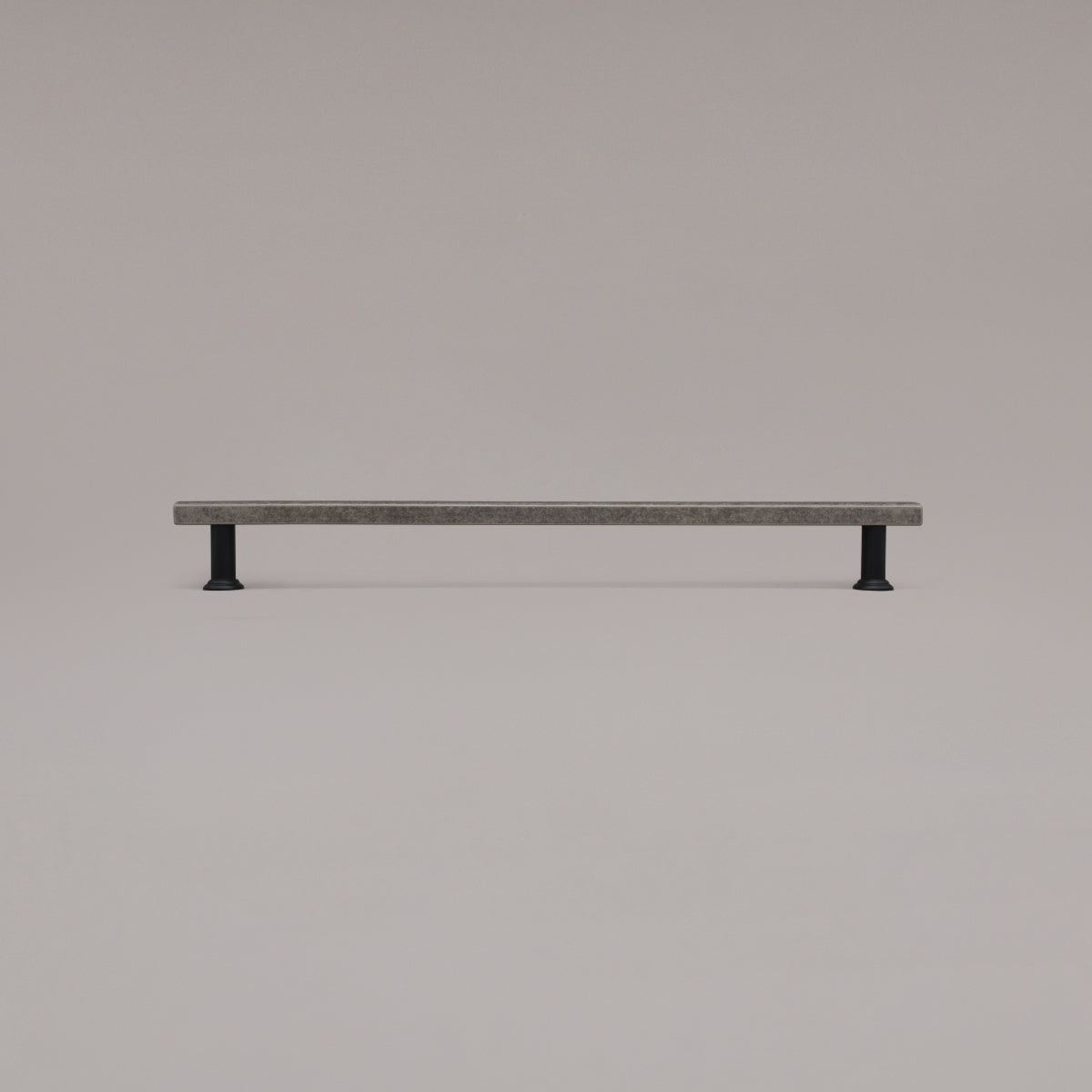 18" Mod appliance pull in Weathered Nickel and Matte Black standing on gray background