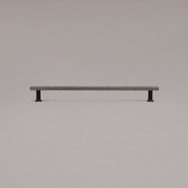 18" Mod appliance pull in Weathered Nickel and Matte Black standing on gray background