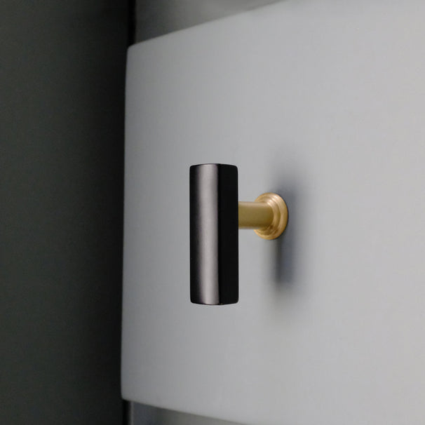 Black and Satin Brass Mod T-Knob on Blue Drawer in Bathroom
