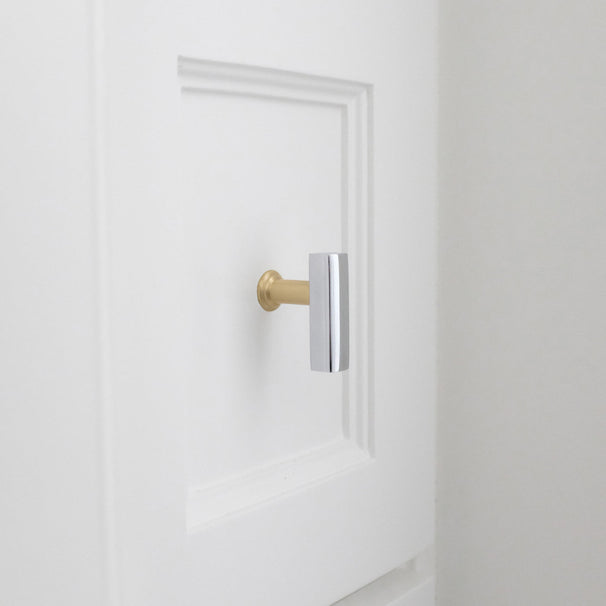 white Bathroom drawer with satin brass and polished chrome two tone t-knob brass cabinet knob.