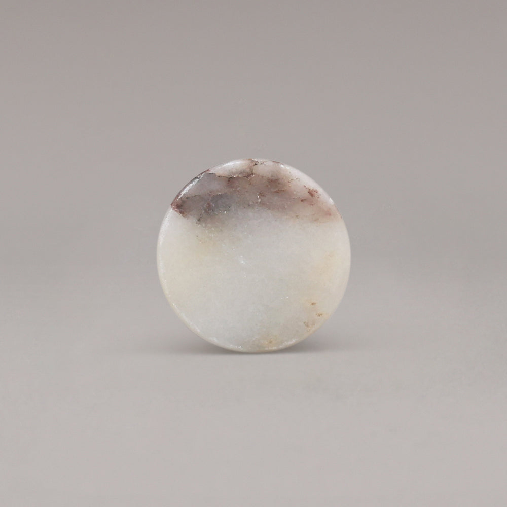 front view of calacatta viola marble cone knob on gray background