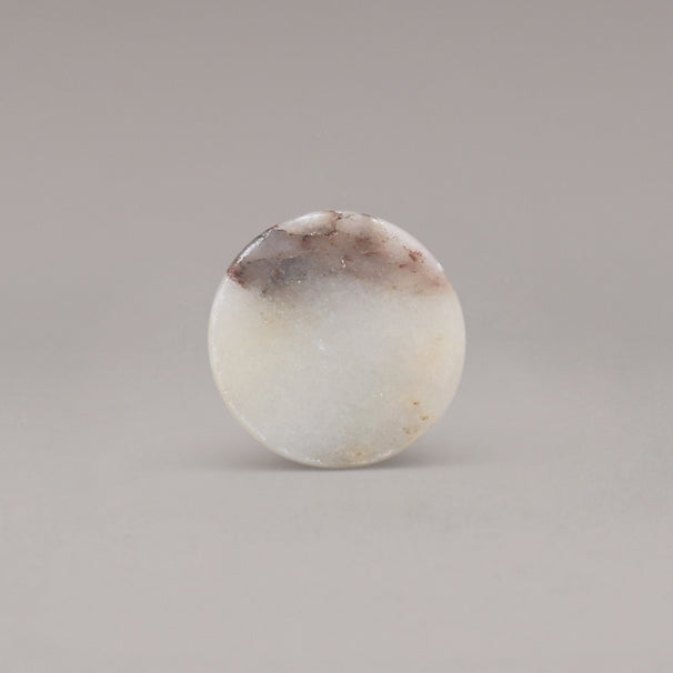 front view of calacatta viola marble cone knob on gray background