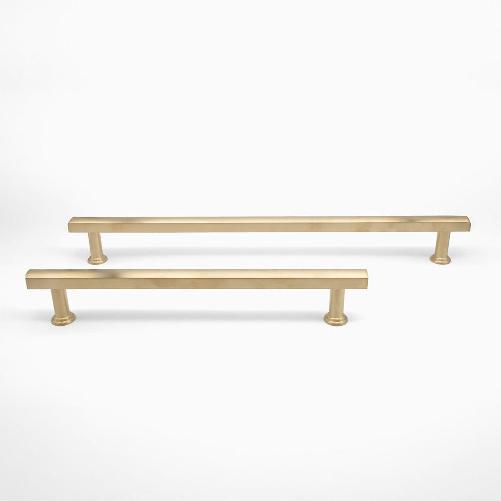 12" and 18" Mod appliance pulls in Unlacquered Satin Brass standing on white background