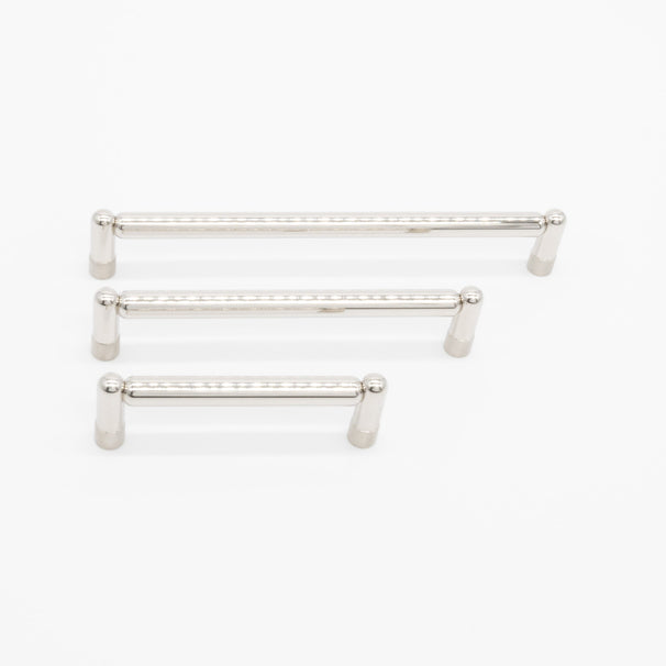 three sizes of polished nickel knurled pull on a white background