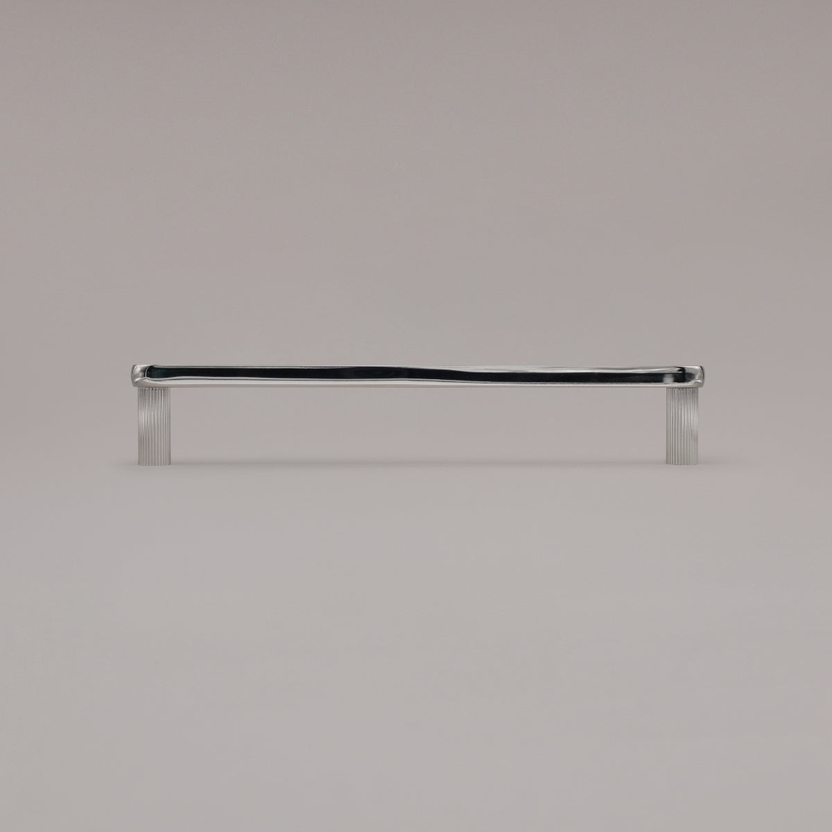 12" Ribbed appliance pull in Polished Nickel standing on gray background