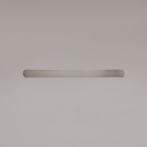 12" Ribbed appliance pull in Satin Nickel laying on gray background