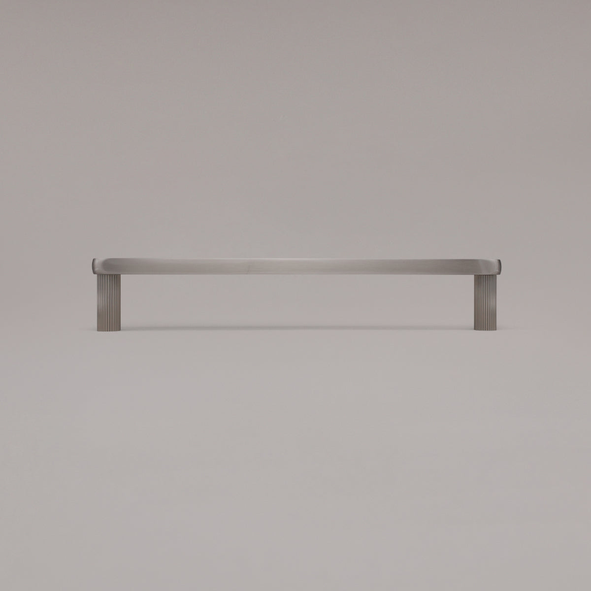 12" Ribbed appliance pull in Satin Nickel standing on gray background