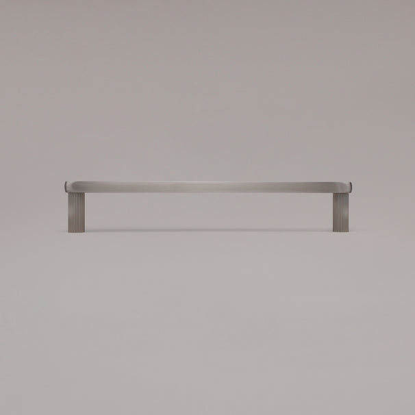 12" Ribbed appliance pull in Satin Nickel standing on gray background