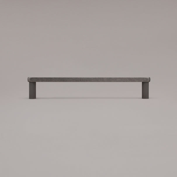 12" Ribbed appliance pull in Weathered Nickel standing on gray background
