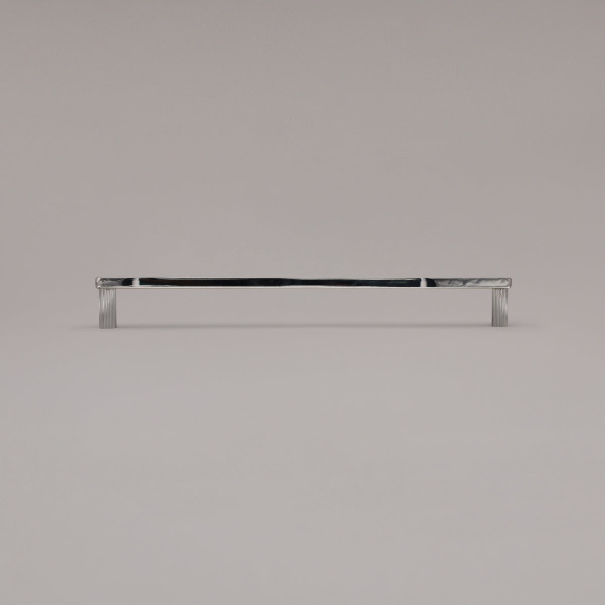18" Ribbed appliance pull in Polished Nickel standing on gray background