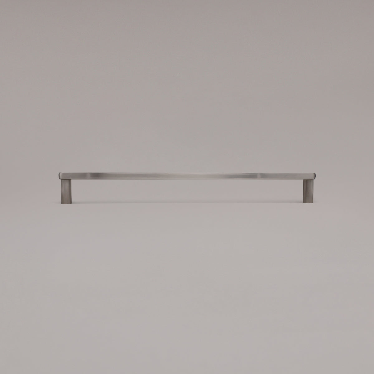 18" Ribbed appliance pull in Satin Nickel standing on gray background
