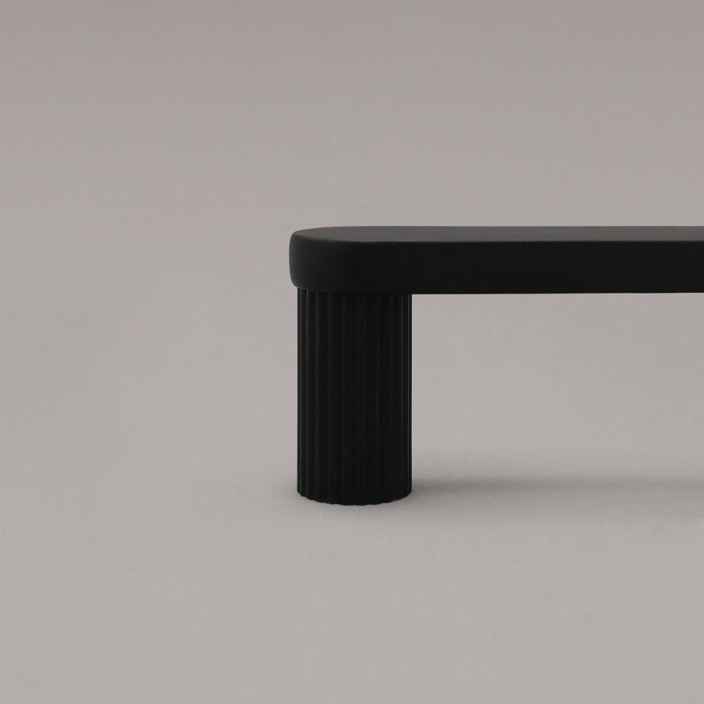 black ribbed cabinet pull close up of stem