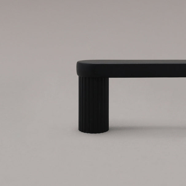 black ribbed cabinet pull close up of stem