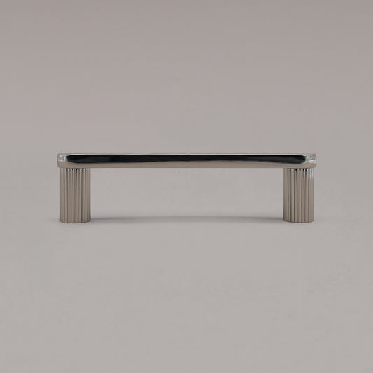 small matte black ribbed pull standing on gray background