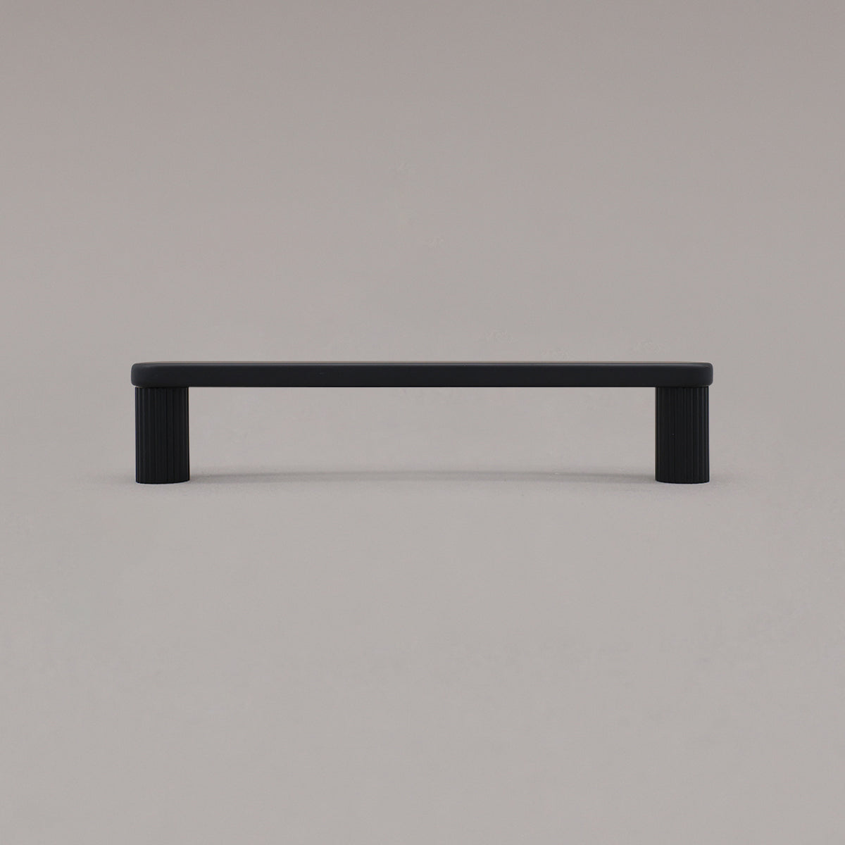 medium matte black ribbed pull standing on gray background