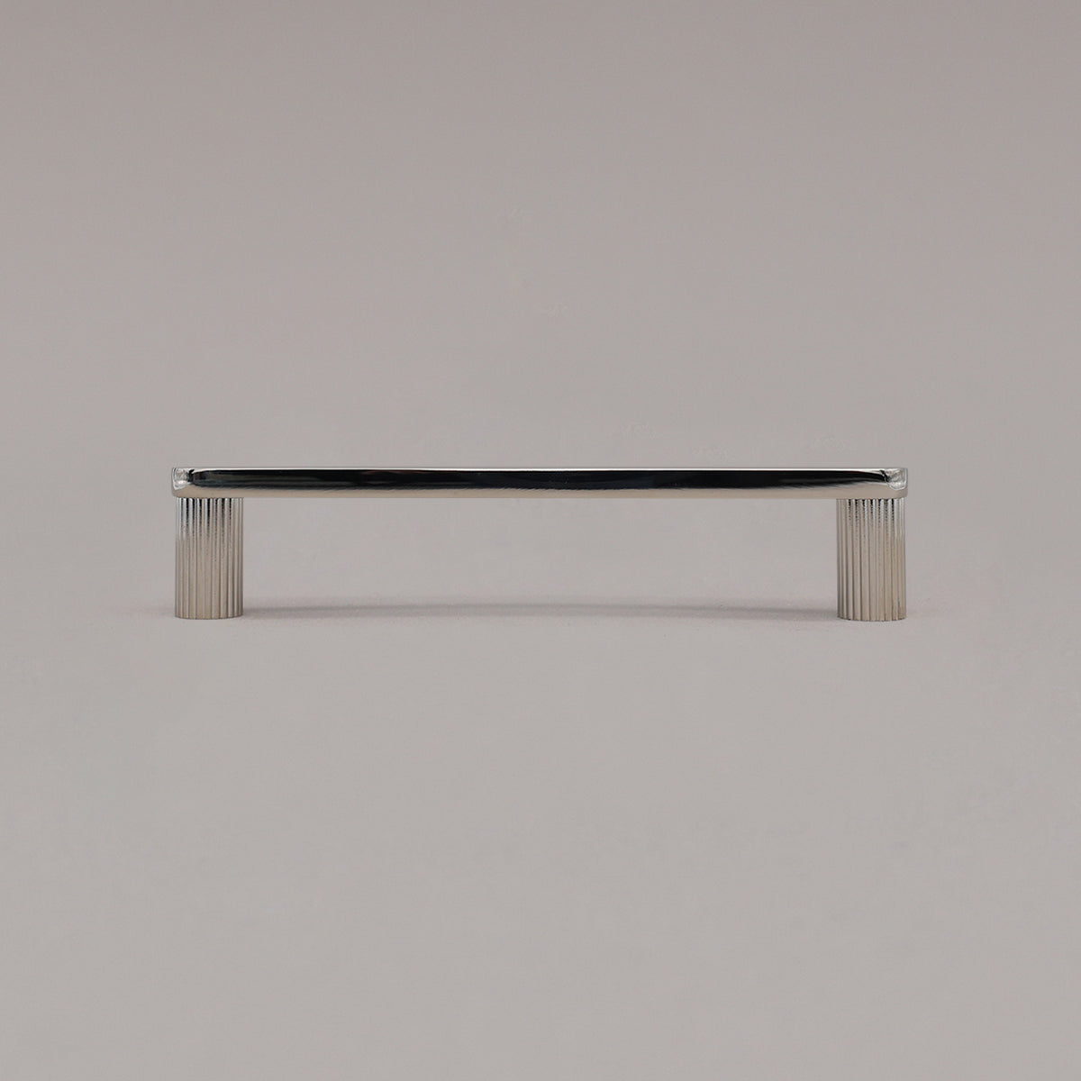 medium polished nickel ribbed pull standing on gray background