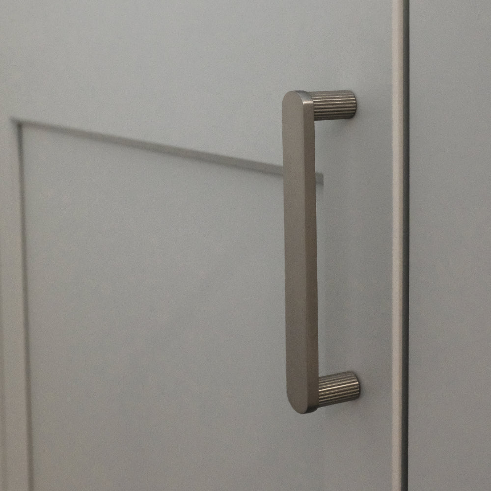 satin nickel pull installed on gray background