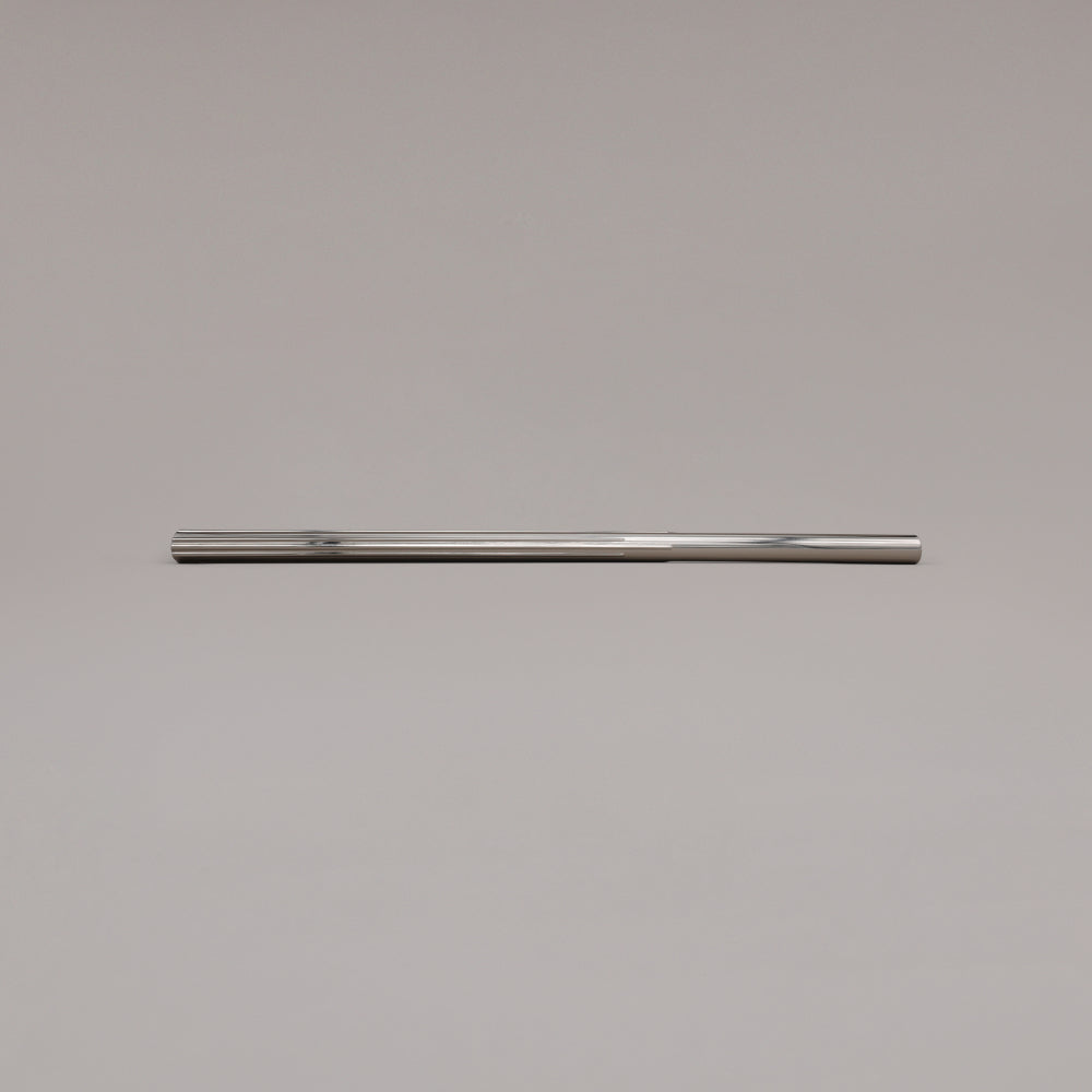 18" Sunburst appliance pull in Polished Nickel laying on gray background