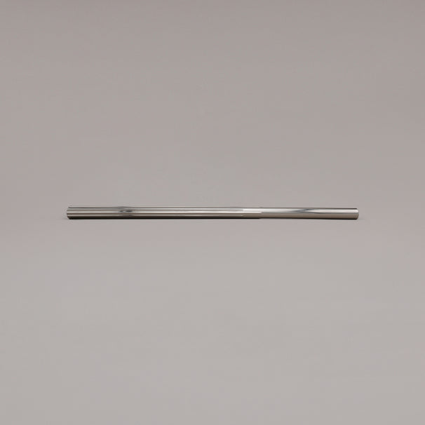 18" Sunburst appliance pull in Polished Nickel laying on gray background
