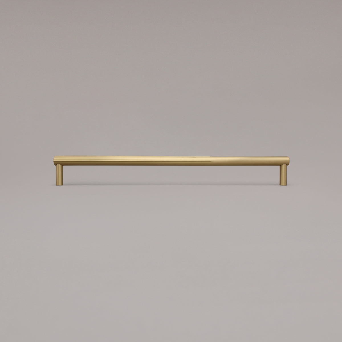 18" Sunburst appliance pull in Satin Brass standing on gray background