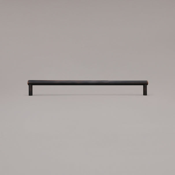 18" Sunburst appliance pull in Venetian Bronze standing on gray background