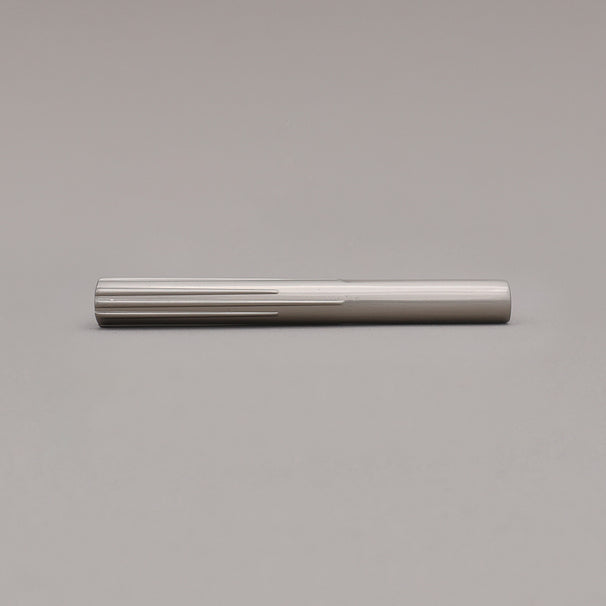 small satin nickel sunburst pull laying on gray background