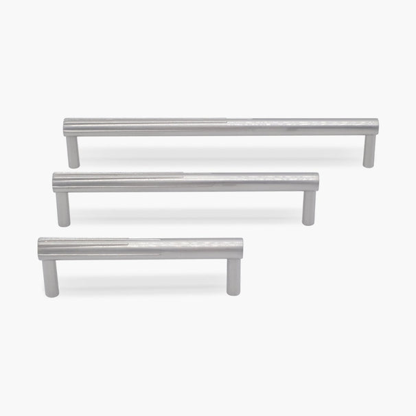 Three sunburst silver satin nickel cabinet pulls in three different sizes on white background