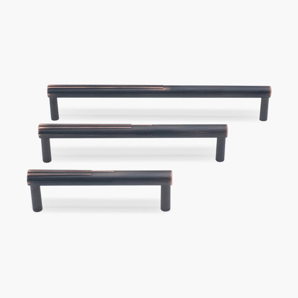 Three venetian bronze sunburst cabinet pulls in three sizes on white background