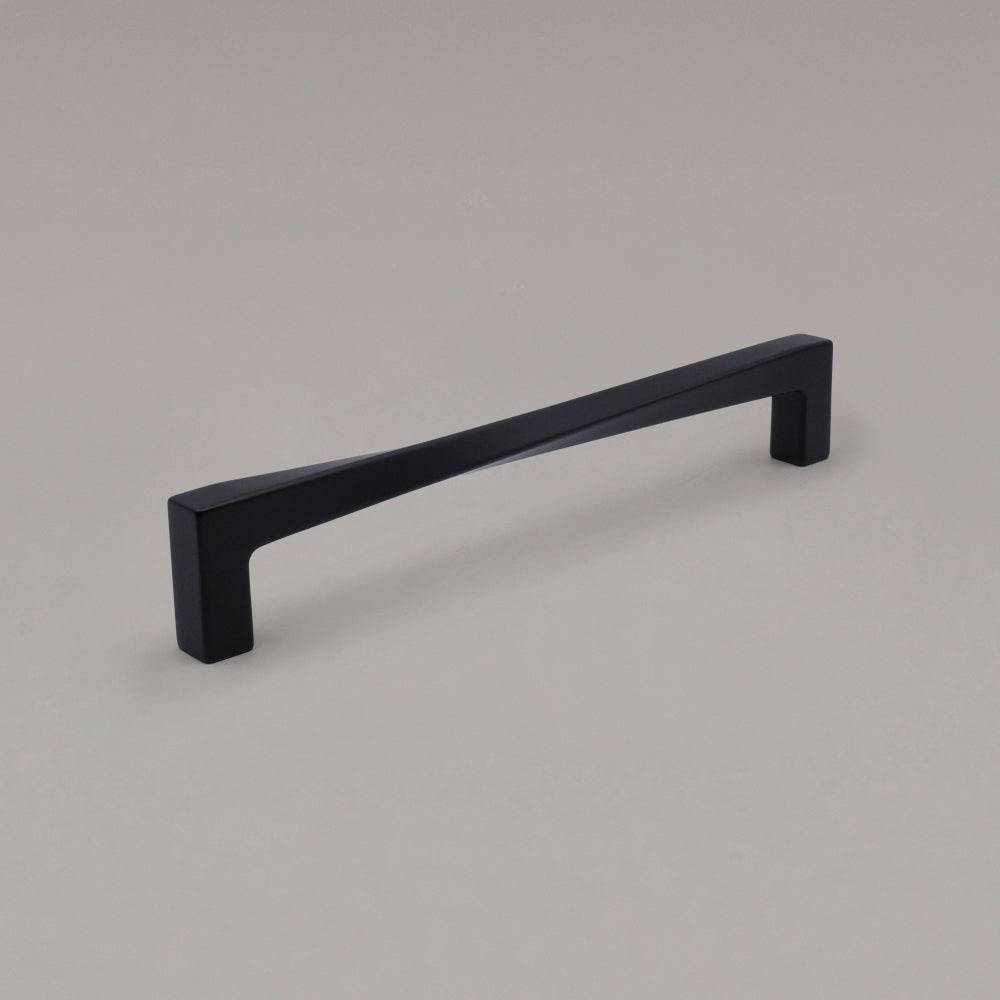 12" Twist appliance pull in Matte Black angled on gray background