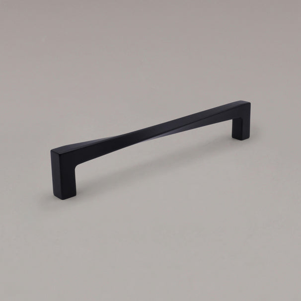 12" Twist appliance pull in Matte Black angled on gray background