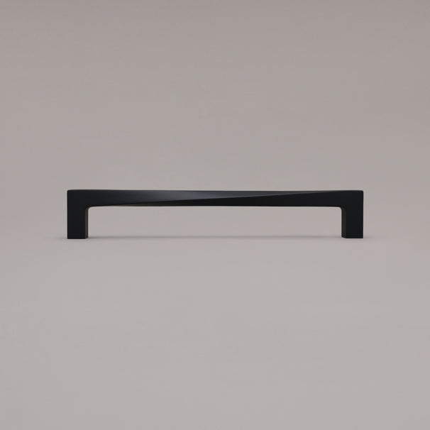 12" twist appliance pull in matte black standing on gray background
