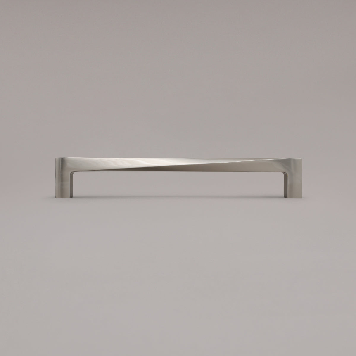 12" twist appliance pull in satin nickel standing on gray background