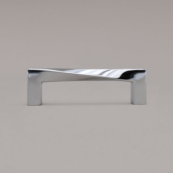 Small polished chrome twist pull standing on gray background