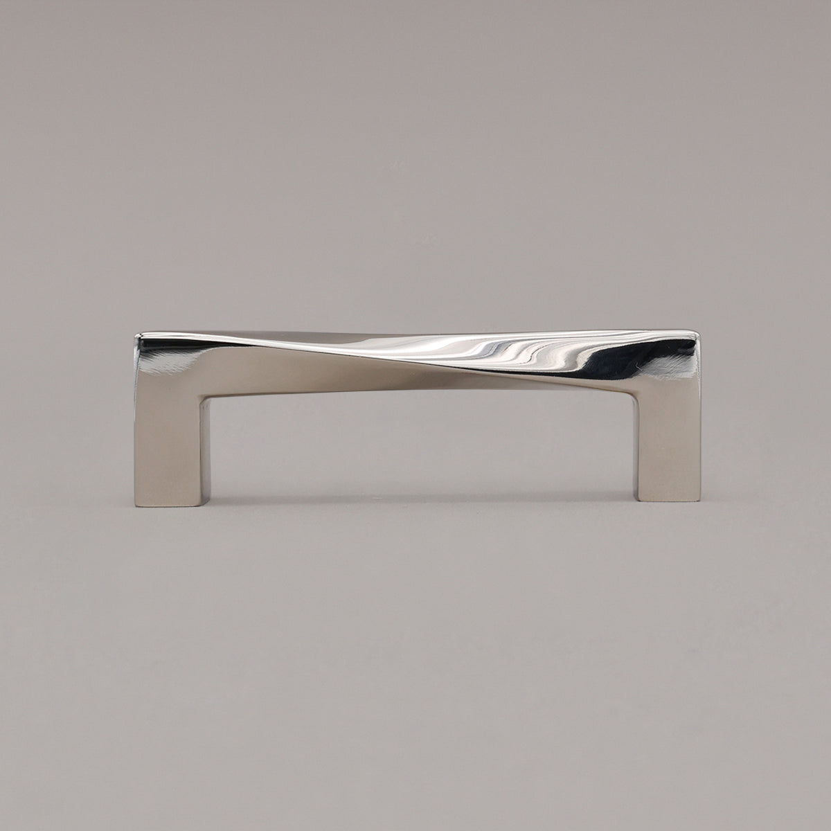Small polished nickel twist pull standing on gray background
