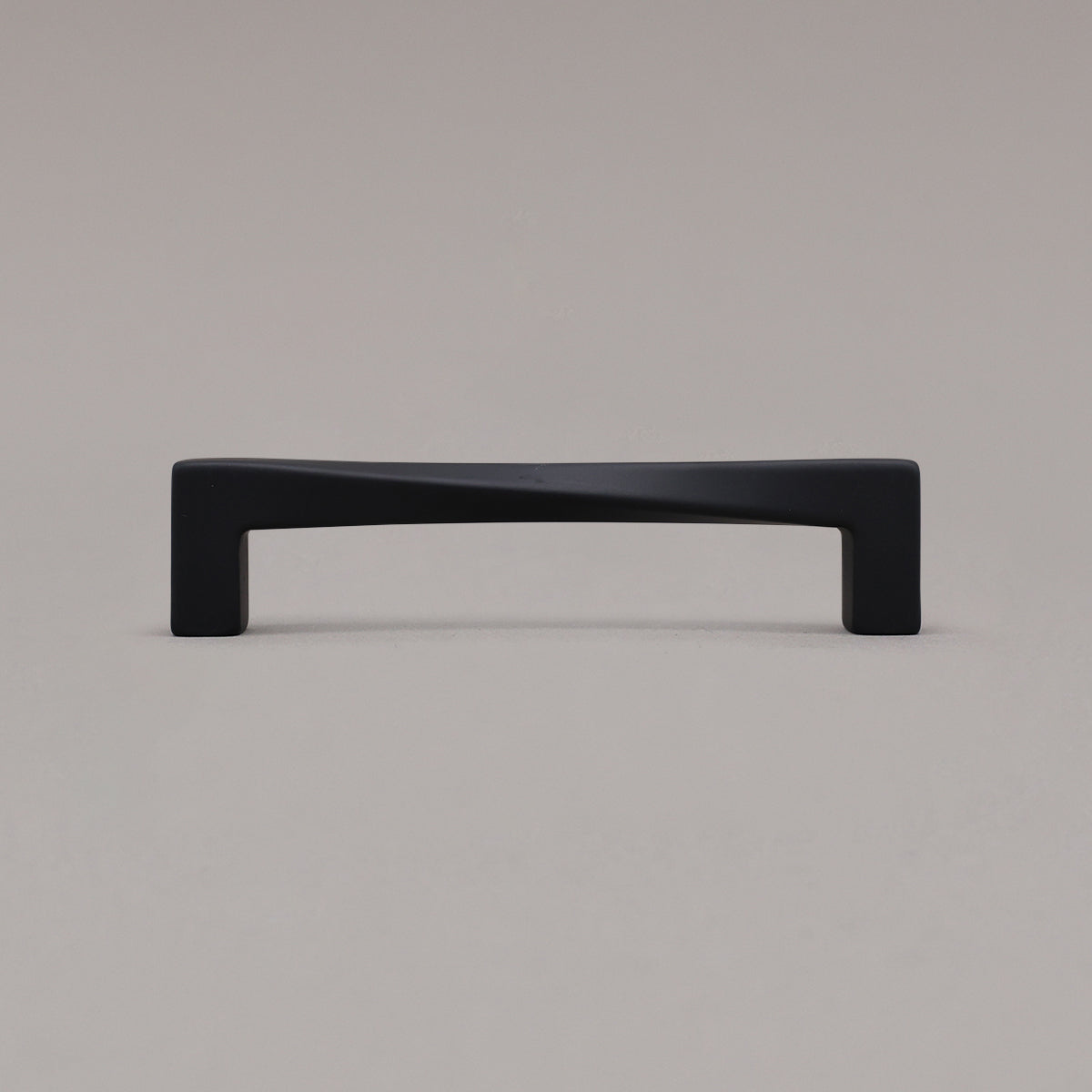 Medium matte black twist pull standing on gray background