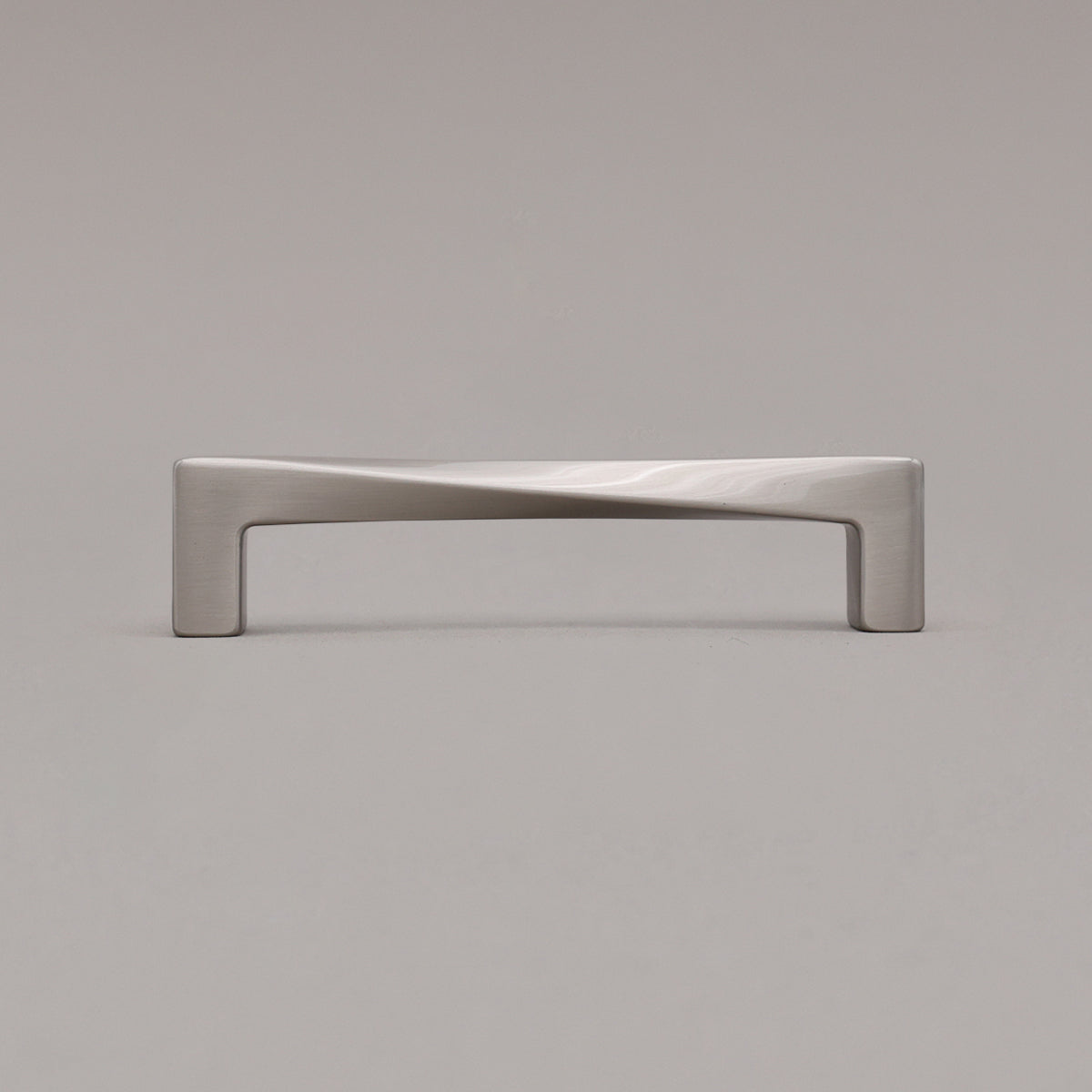 Medium satin nickel silver twist pull standing on gray background