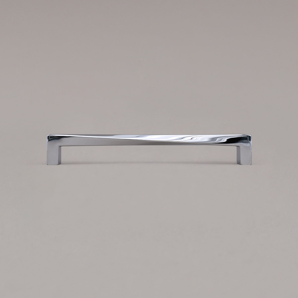 Large polished chrome twist pull standing on gray background