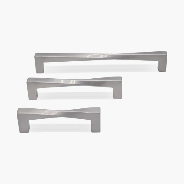 Set of three cabinet pulls for twist collection in satin nickel on white background