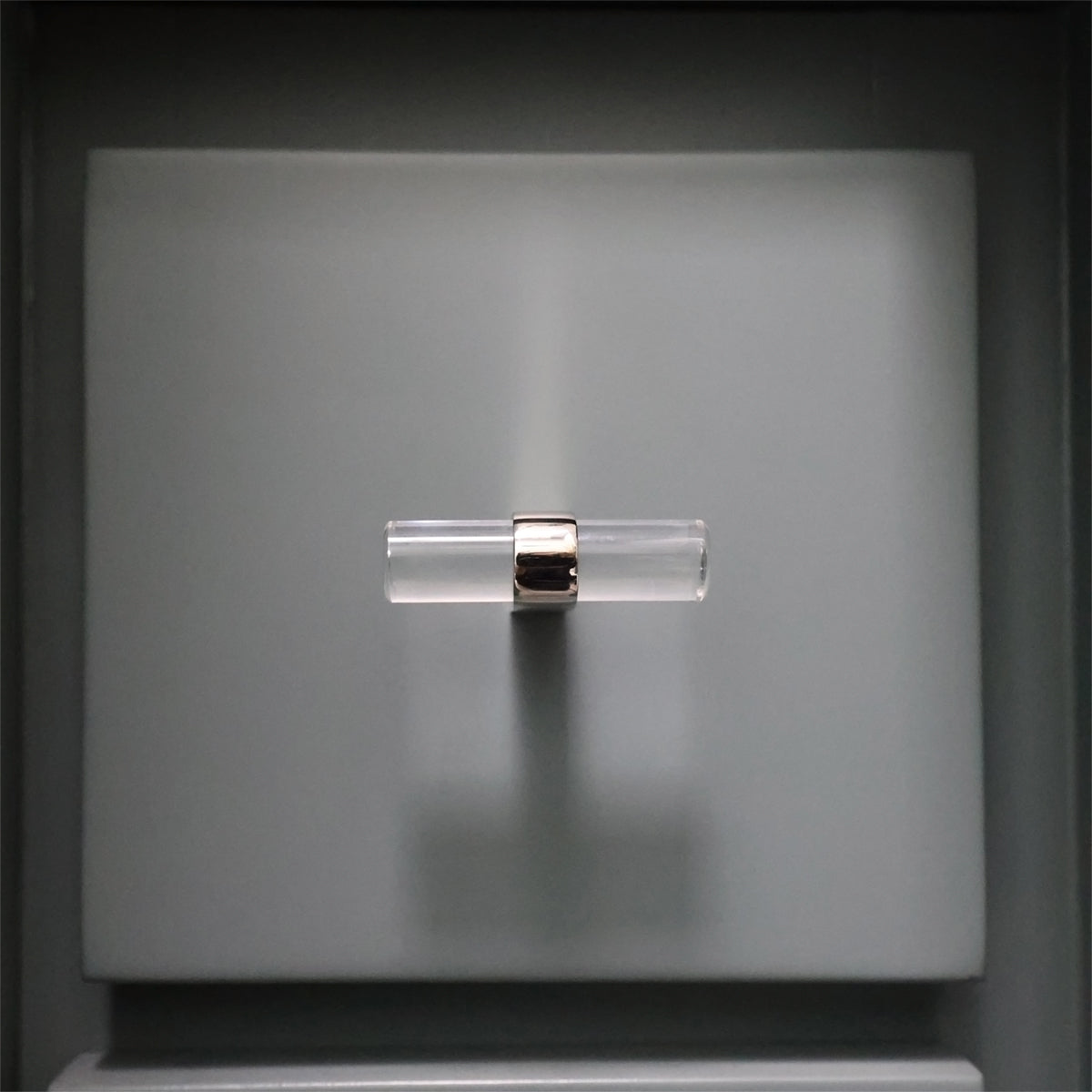 Acrylic Polished Nickel Cabinet Knob on Blue Bathroom Drawer.