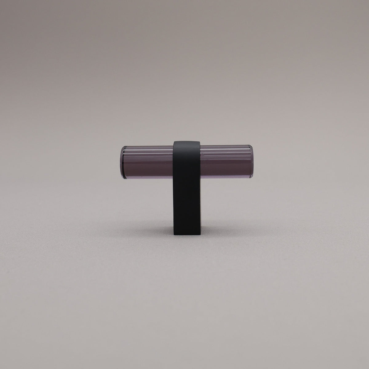 Smoke acrylic and matte black stem knob on gray background